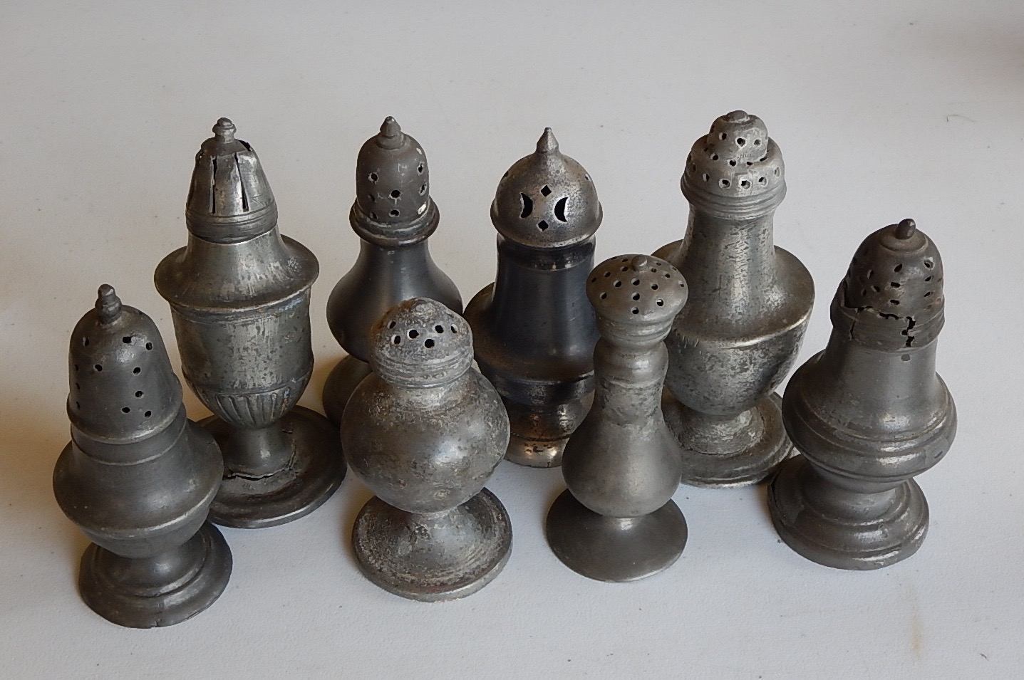 Appraisal: A collection of thC pewter casters for sugar pepper spice