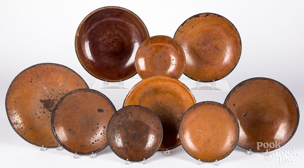 Appraisal: Nine redware plates and chargers th c Nine redware plates