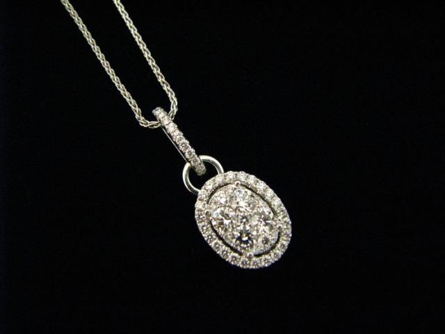 Appraisal: A K white gold cluster diamond pendant containing fifty diamonds