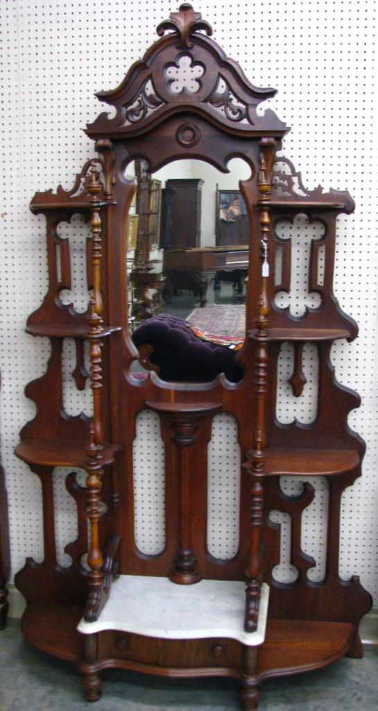 Appraisal: Walnut Victorian carved etagere with white marble mirrored back one