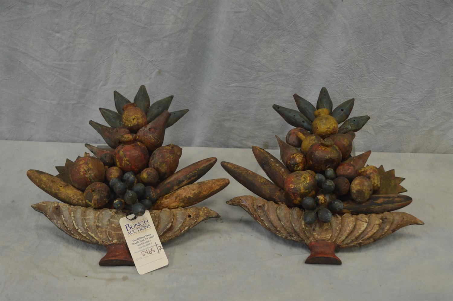 Appraisal: Pair of carved painted pine folk art wall sculptures fruit