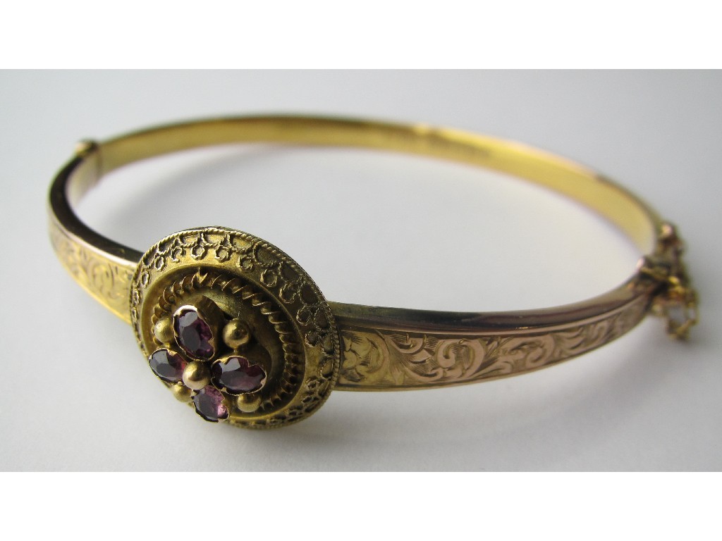 Appraisal: Victorian ct gold almandine garnet set hinged bangle the front