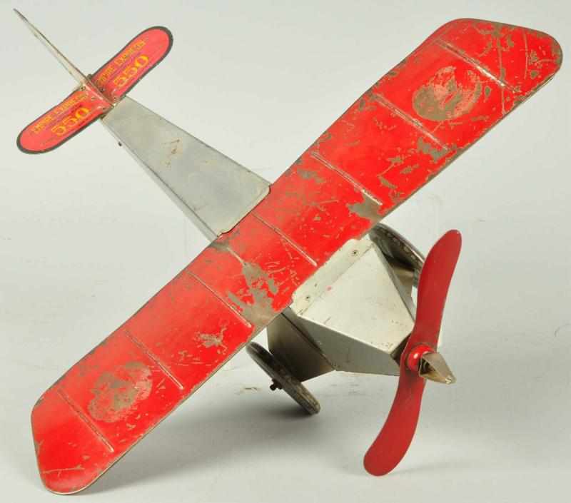 Appraisal: Tin Empire Express Monoplane Wind-Up Toy Description Circa Manufactured by