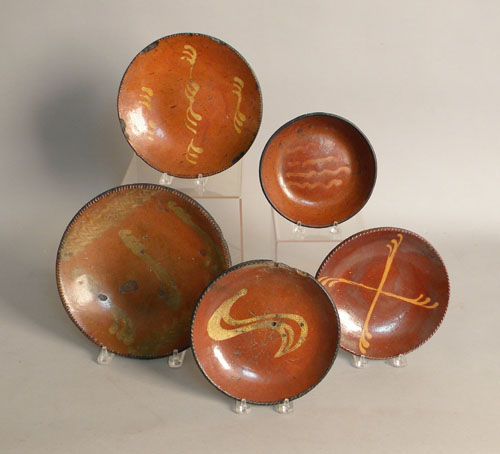 Appraisal: Five slip decorated redware pie plates th c dia -