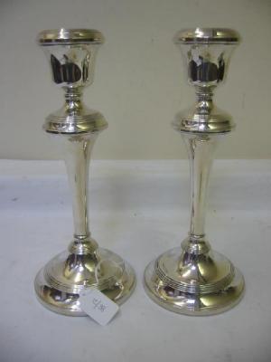 Appraisal: A PAIR OF CANDLESTICKS with urn sconce tapering stem and