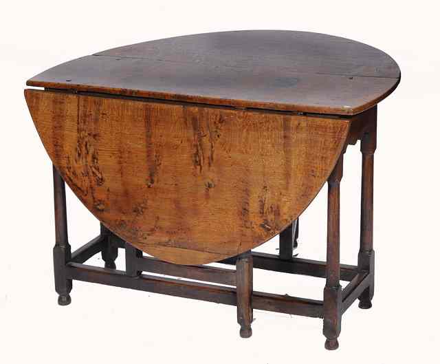 Appraisal: AN TH CENTURY OVAL OAK GATELEG TABLE with end drawer