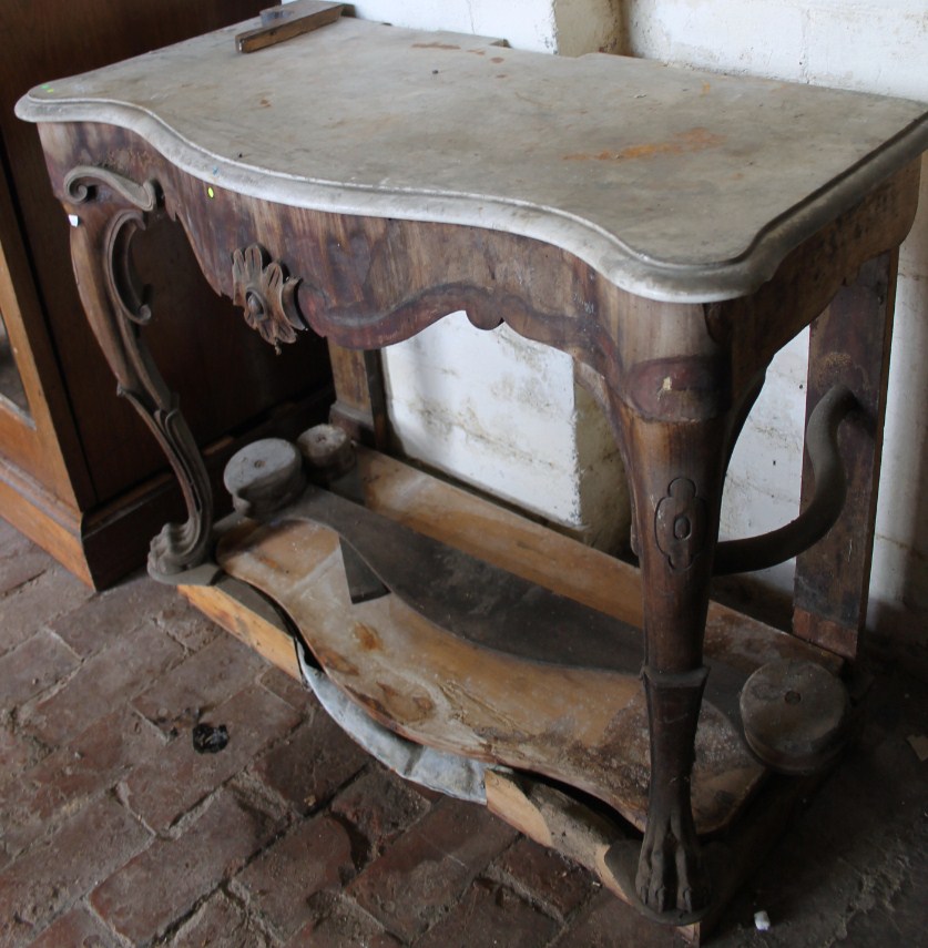 Appraisal: An thC marble topped hall table the frieze centred by