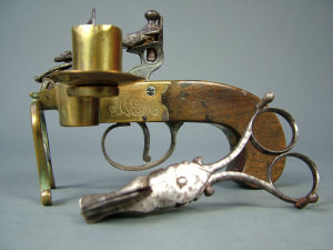 Appraisal: A George III brass framed boxlock flintlock tinder-lighter with plain