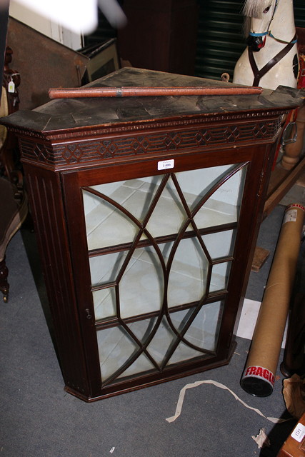 Appraisal: AN EARLY TH CENTURY MAHOGANY CORNER CUPBOARD with glazed door