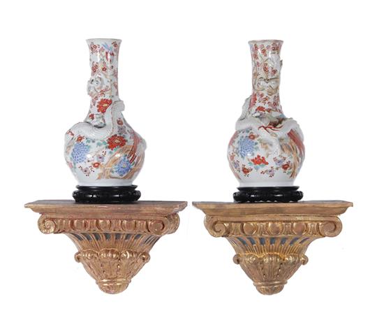 Appraisal: Pair Chinese porcelain vases on stands and brackets dragon vases