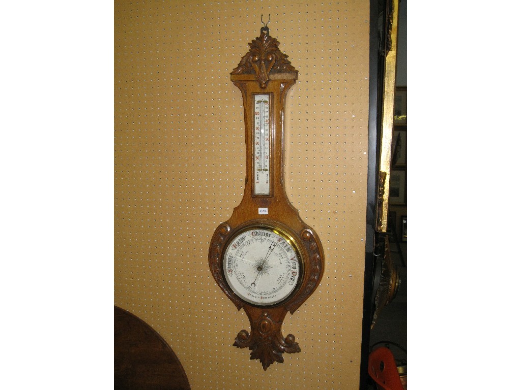 Appraisal: Carved oak cased banjo barometer