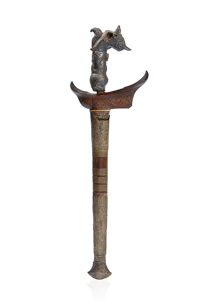 Appraisal: Javanese Kris A Javanese Kris with silver covered grip and