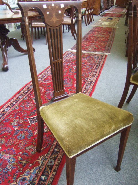 Appraisal: A set of four Edwardian mahogany dining chairs of Arts