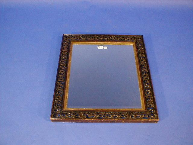 Appraisal: A Victorian rectangular framed wall mirror with bevel plate and