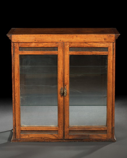 Appraisal: Edwardian Fruitwood Shop Cabinet ca the dentillated cornice above a