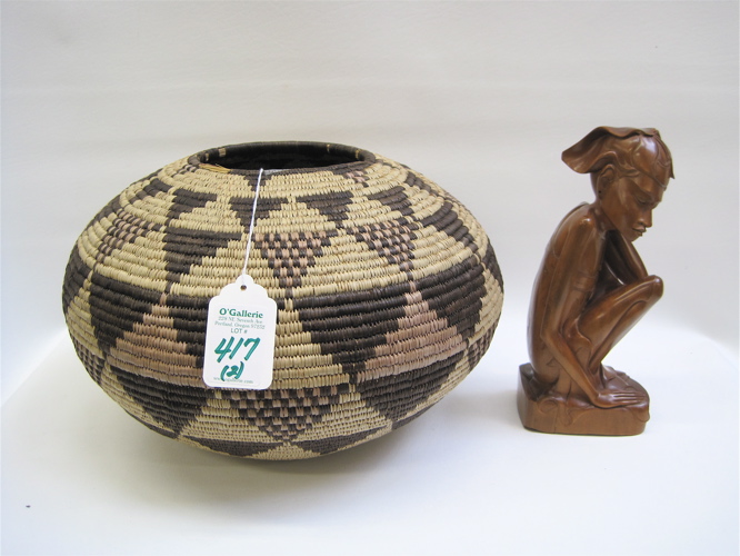 Appraisal: AN AFRICAN HAND WOVEN BASKET AND CARVED INDONESIAN FIGURE the