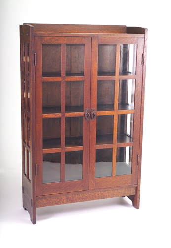 Appraisal: GUSTAV STICKLEY Two-door china cabinet with gallery top and copper