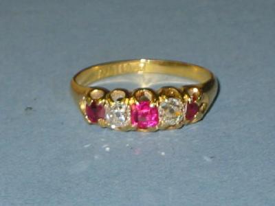 Appraisal: A FIVE STONE RUBY AND DIAMOND RING comprising three rubies