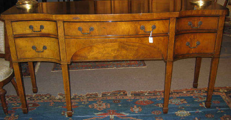 Appraisal: NAHON HEPPLEWHITE STYLE MAHOGANY SIDEBOARD With shaped top over the