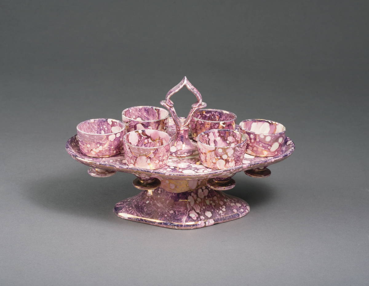 Appraisal: RARE BRITISH MOTTLED PINK LUSTRE EGG CUP STAND PROBABLY STAFFORDSHIRE