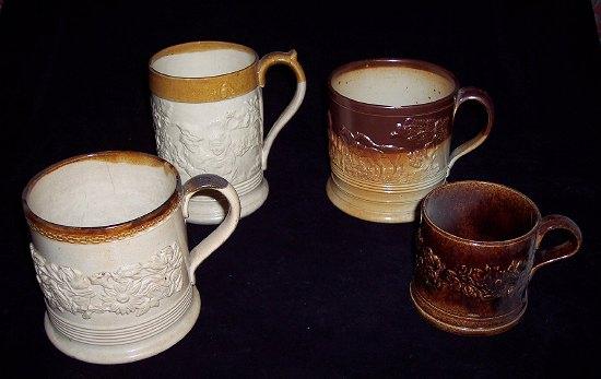 Appraisal: A brown glazed stoneware cider mug with hunting scenes in