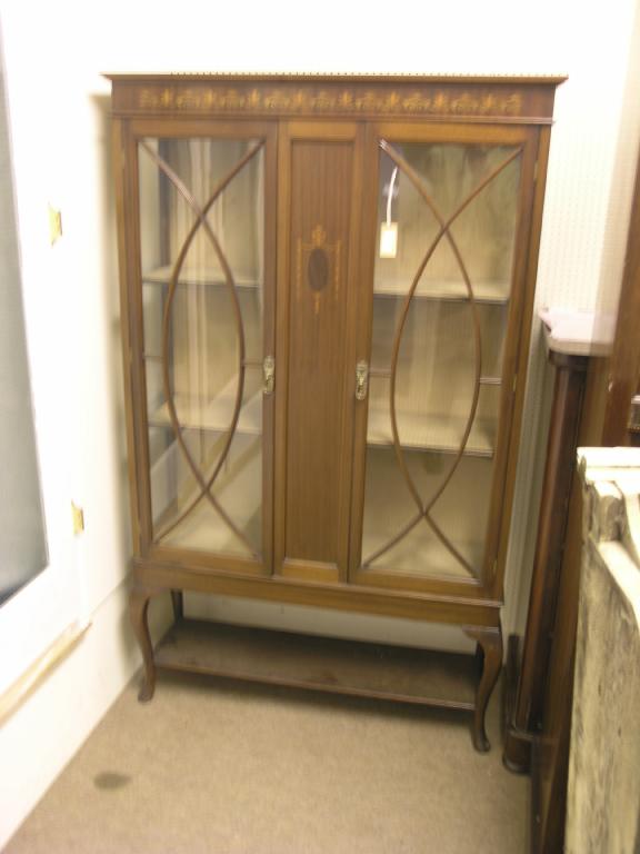 Appraisal: An Edwardian inlaid mahogany display cabinet lined interior with two