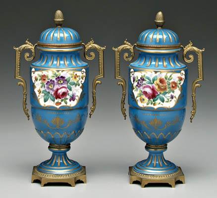 Appraisal: Pair Sevres lidded urns hand painted floral bouquets on blue