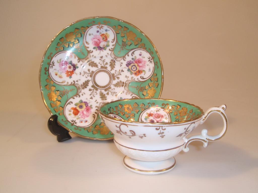 Appraisal: A Ridgway cabinet cup and saucer painted with floral spays