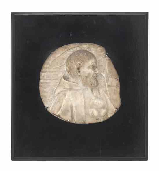 Appraisal: A Continental Carved Marble Relief Fragment depicting a saint in