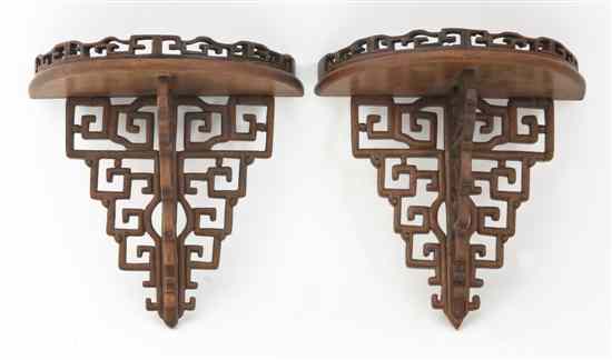 Appraisal: A Pair of Chinese Carved Hardwood Brackets of galleried demilune