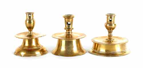 Appraisal: Three brass capstan candlesticks th c h h and h