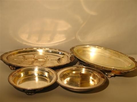 Appraisal: FOUR PIECES OF GADROONED BORDER SERVING WARES Each item of