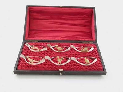 Appraisal: A modern cased set of six parcelgilt napkin rings each