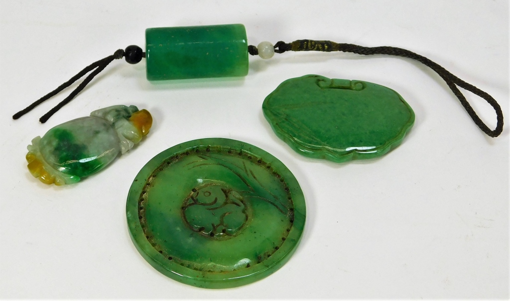 Appraisal: CHINESE APPLE GREEN MOTTLED JADEITE AMULETS China Qing DynastyIncludes one