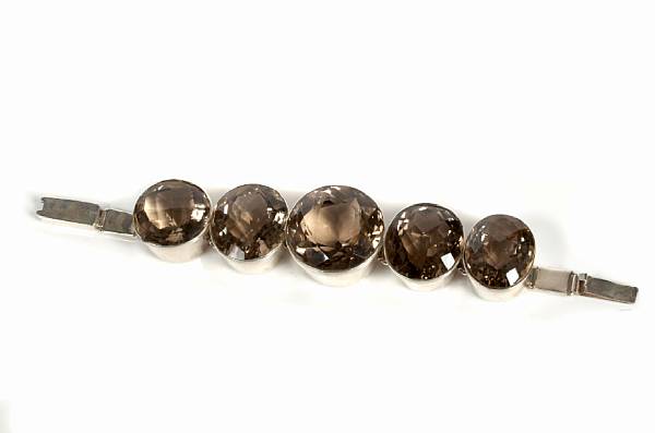 Appraisal: A round smoky quartz and silver large bracelet featuring five