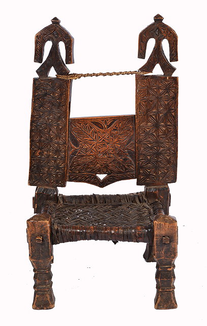 Appraisal: A NEPALESE CARVED HARDWOOD LOW CHAIR with three panelled back