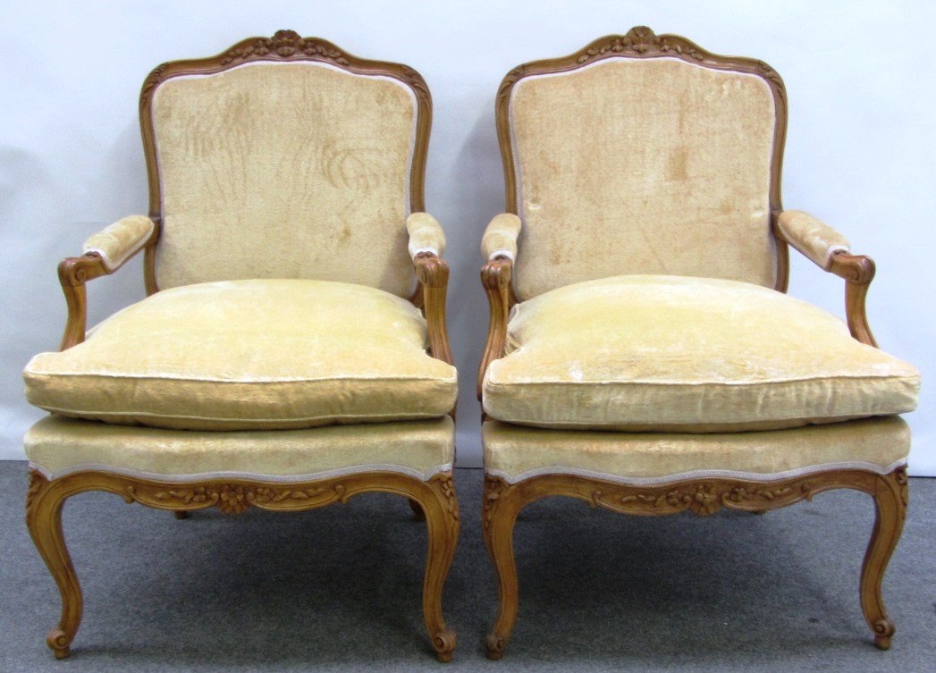 Appraisal: A pair of Louis XV style stained beech fauteuils each