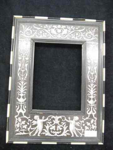 Appraisal: Victorian Inlaid Ivory Ebony PictureFrame cherub gryphon vine decor overall