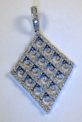 Appraisal: DIAMOND AND EIGHTEEN KARAT GOLD PENDANT white gold and covered