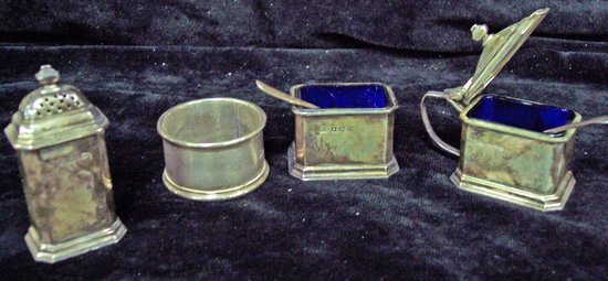 Appraisal: A mustard pot pepper pot and salt cellar Birmingham and