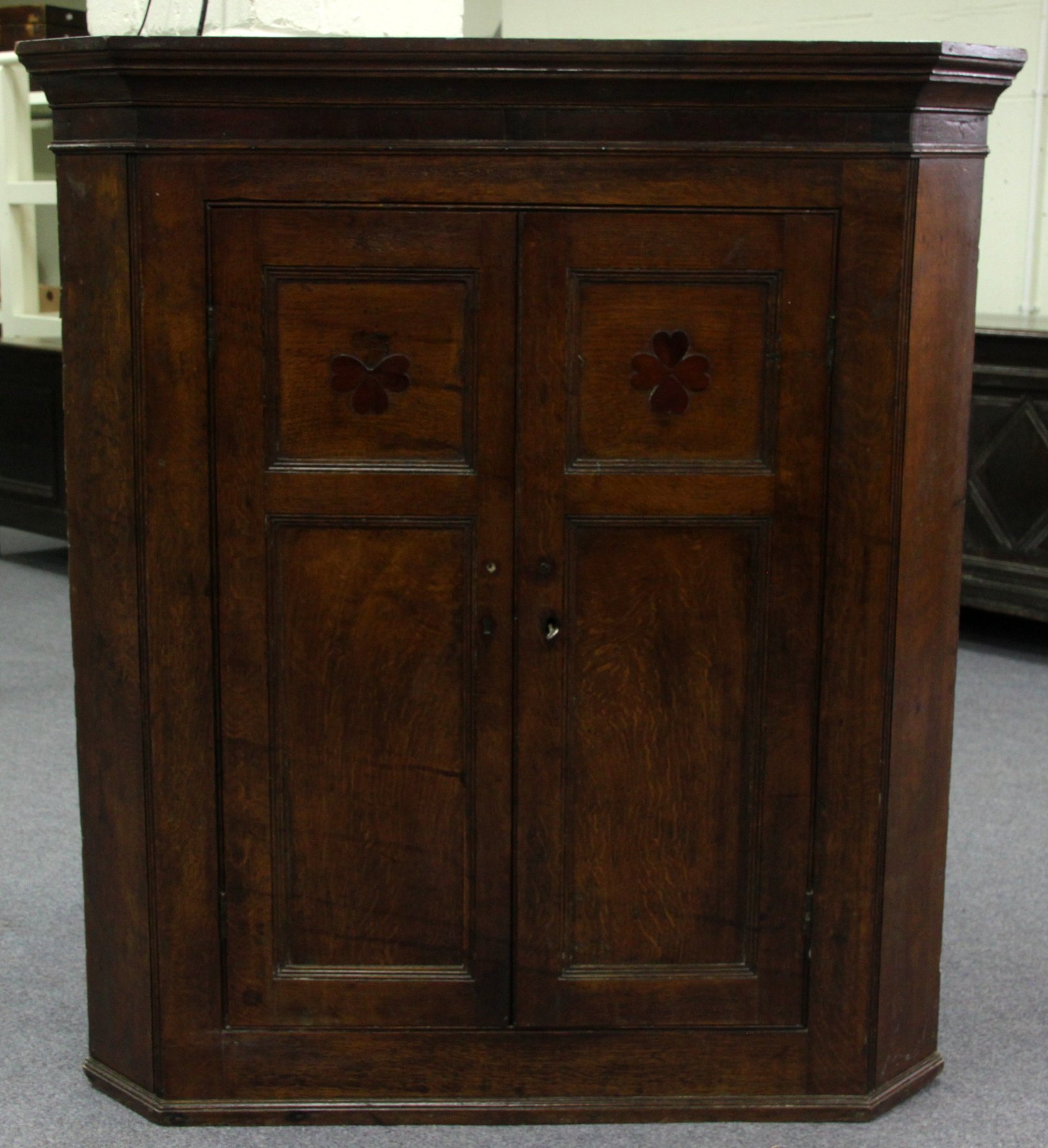 Appraisal: An early th Century oak corner cupboard fitted adjustable shelves