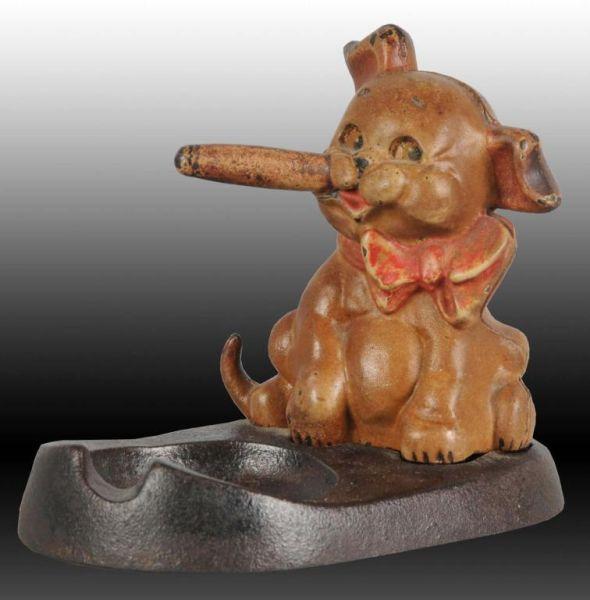 Appraisal: Puppy with Cigar Dog Cast Iron Ash Tray Description Made