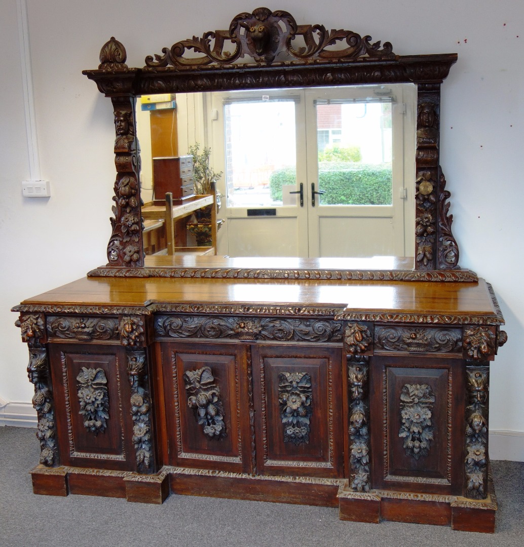 Appraisal: A large th century carved oak sideboard the mirror back