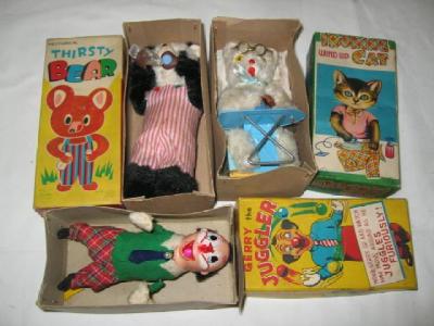 Appraisal: Japanese clockwork novelty toys Ironing Cat Thirsty Bear and Gerry