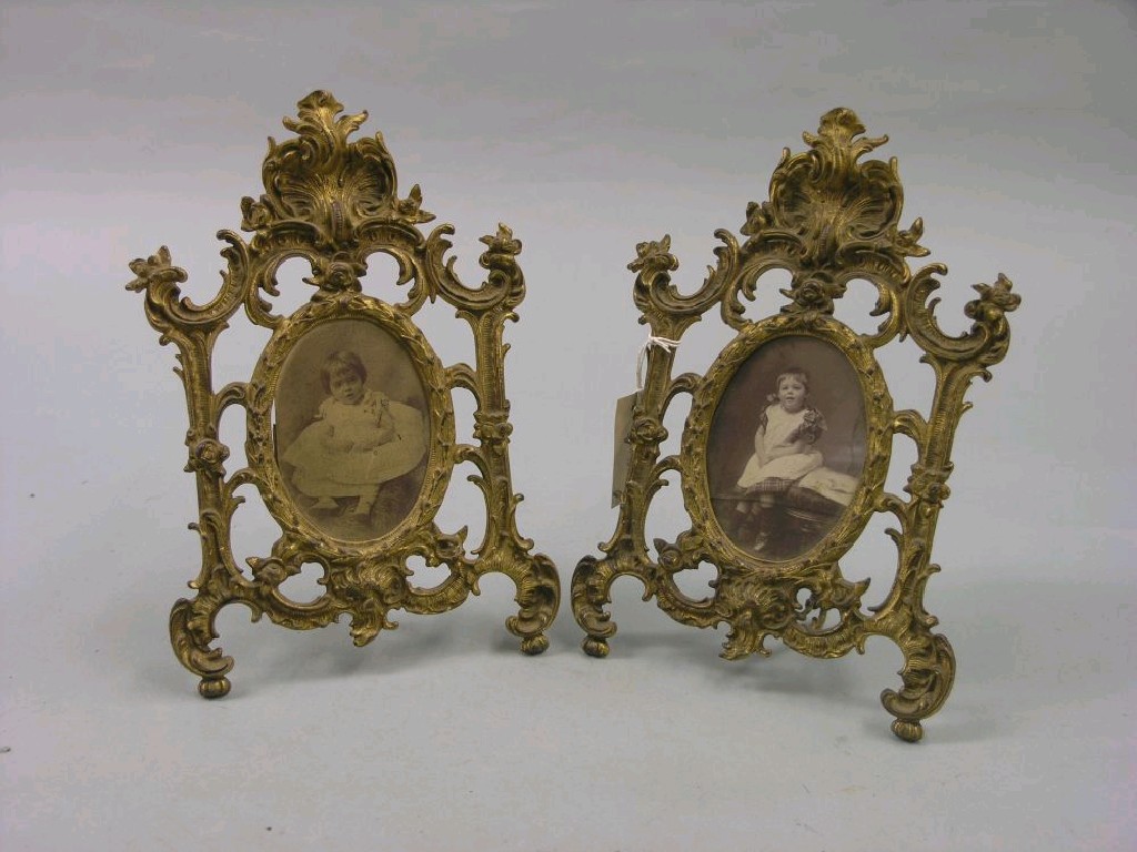 Appraisal: A pair of th century gilt brass photograph frames elaborately