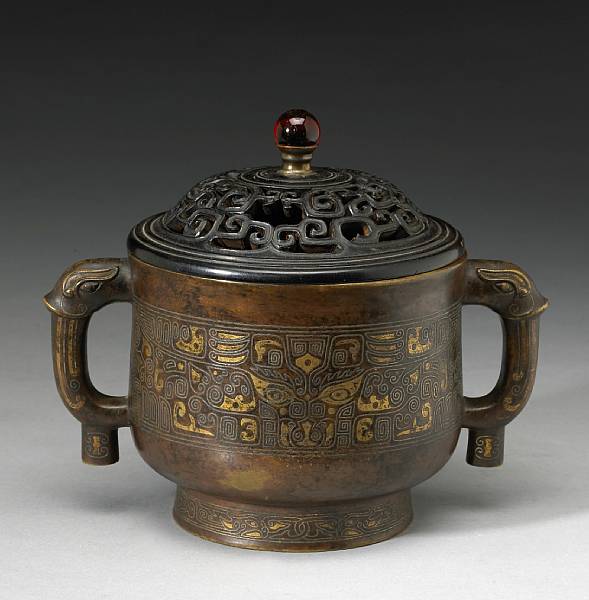 Appraisal: A cast bronze incense burner with silver and gilt decoration