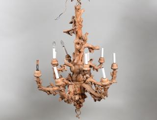 Appraisal: TEN LIGHT CARVED AND BLEACHED WOOD CHANDELIER In the form