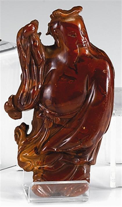 Appraisal: Chinese amber carved model of a Immortal qing dynasty Of