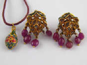 Appraisal: A pair of Indian enamelled diamond and ruby earrings approx