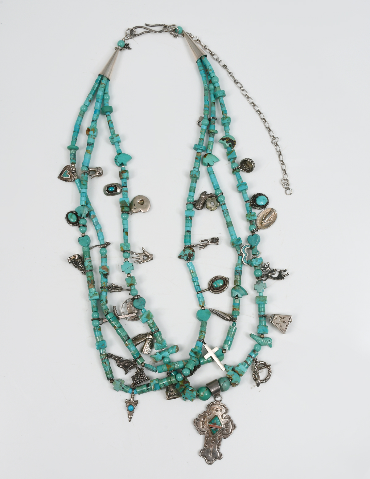 Appraisal: SOUTHWEST TURQUOISE SILVER CHARM NECKLACE Various shapes and sizes of